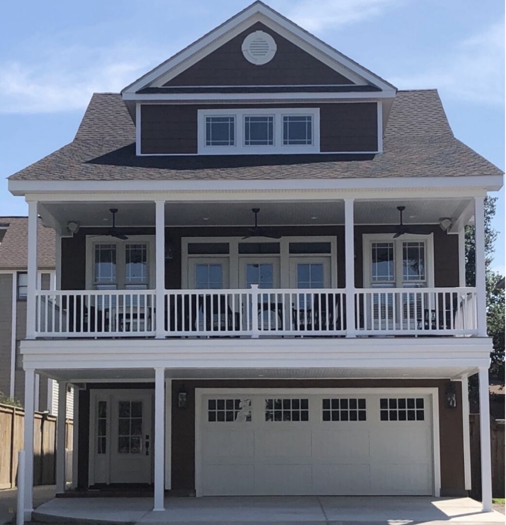 Two-story house with balcony and garage