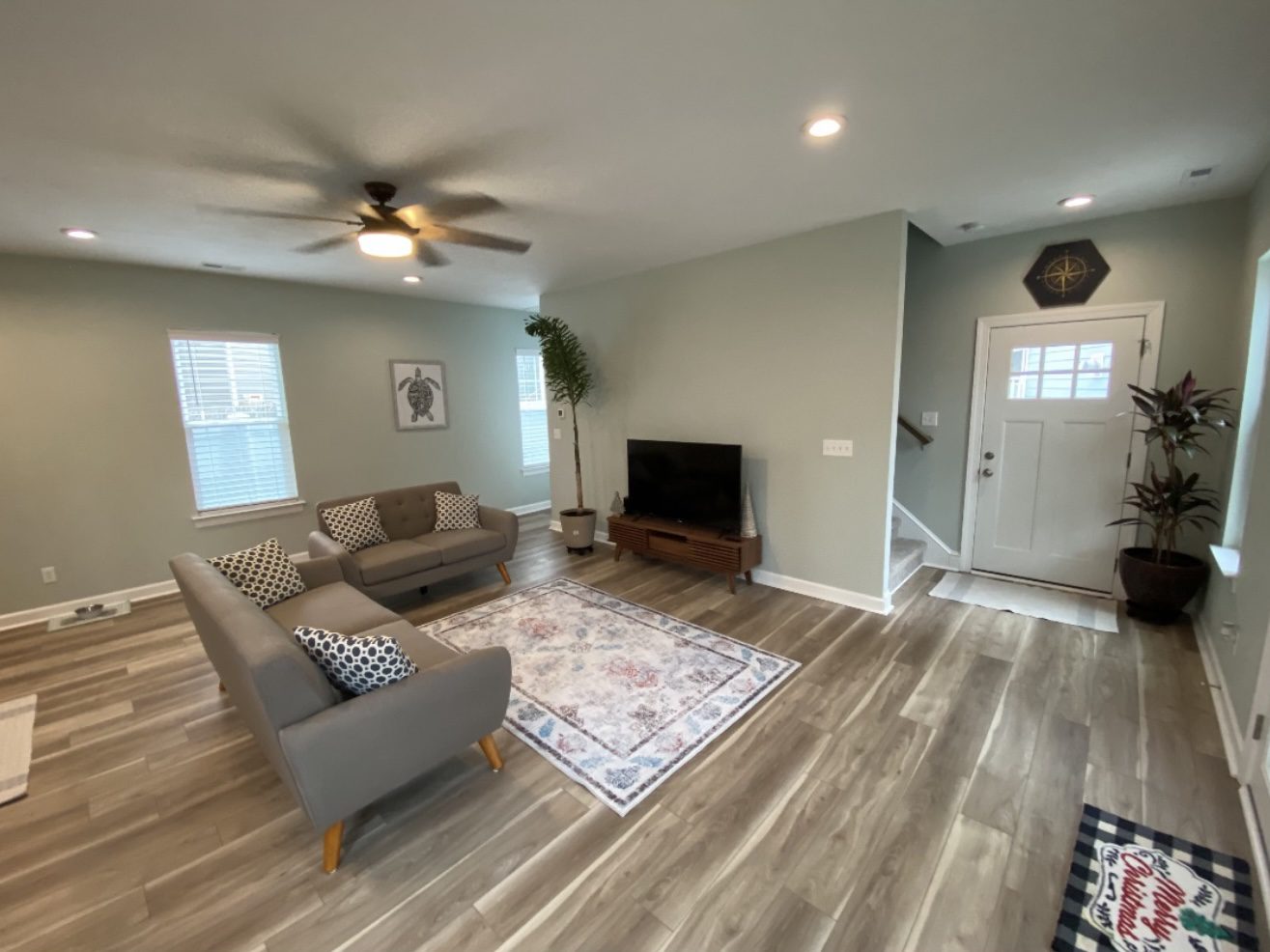 Bright modern living room with gray sofas