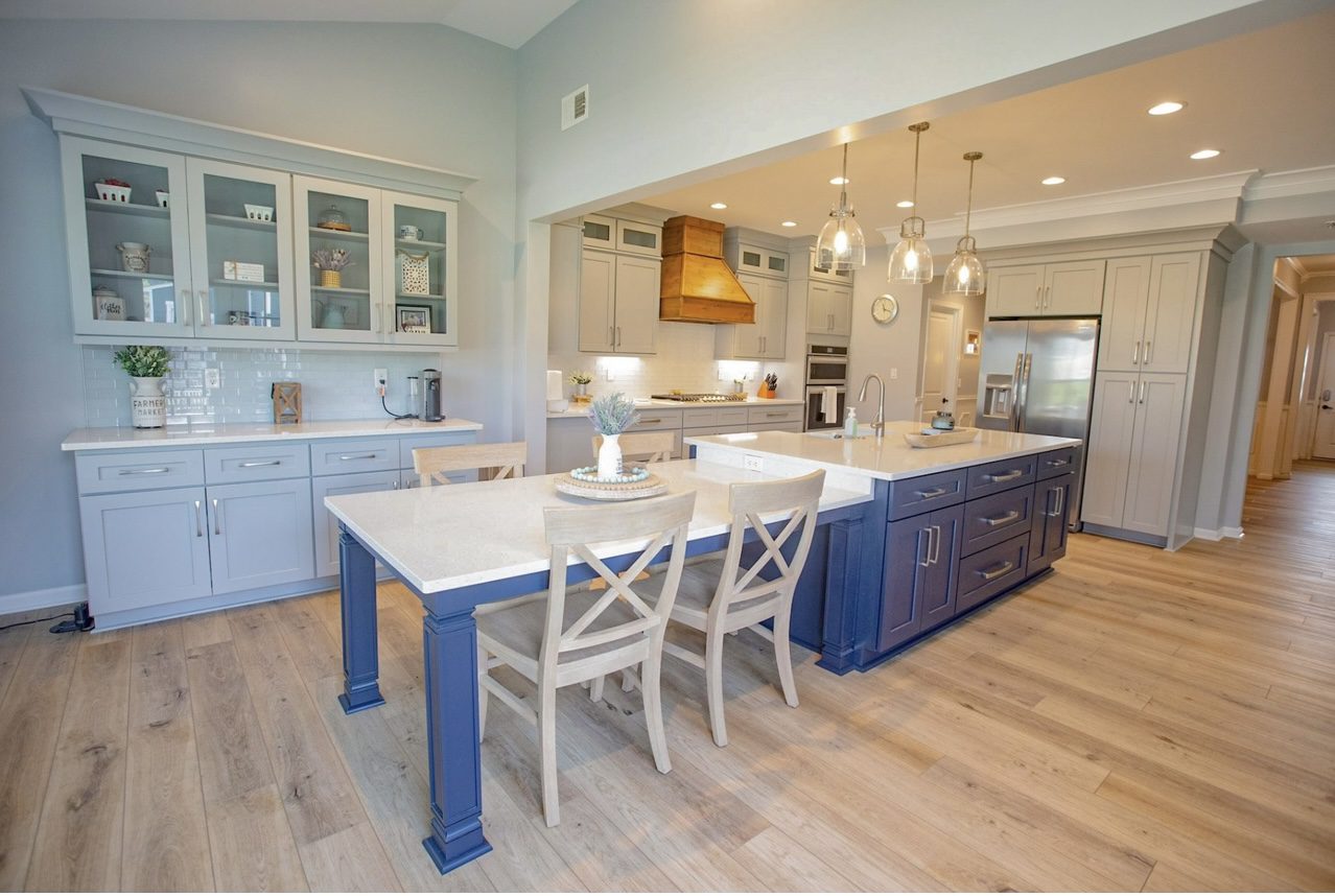 Bright modern kitchen with blue island